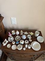 Full view of all miniature porcelain pieces on dresser top
