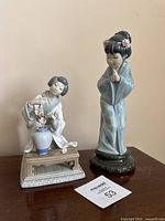 Front view of both Lladro figurines