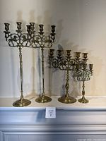 All three brass candelabras side by side
