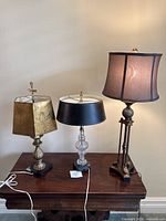 Three table lamps on table showing overall design and shades