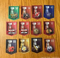 Front view of 12 Stanley Cup banner cards by Molson NHL showing team logos, Stanley Cup trophy, and championship years.