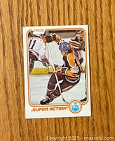 Front side of the hockey card showing Wayne Gretzky in Edmonton Oilers uniform in action with O-Pee-Chee logo and card number 125.