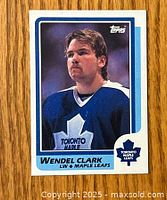 Front side of Wendel Clark rookie card showing player photo and Topps branding.