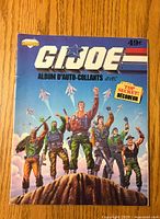 Front cover of 1986 GI Joe sticker album showing illustrated GI Joe characters and French text.