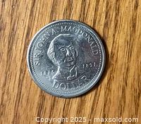 Obverse side of the 1991 Sir John A Macdonald Dollar coin showing Sir John A Macdonald's portrait and inscriptions.