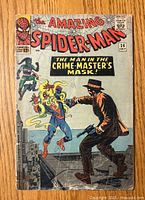Front cover of The Amazing Spider-Man #26 comic book showing Spider-Man with Crime Master in lower grade condition with wear and creasing