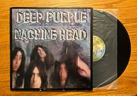 Top-down image showing the front of the 'Machine Head' album cover and partially pulled-out vinyl record.