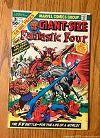 Front cover photo showing the colorful illustrated cover of Fantastic Four Giant-Size #3, featuring The Four Horsemen of Apocalypse battle scene.