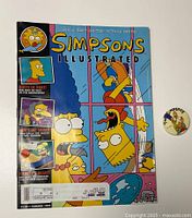 Front cover of Simpsons Illustrated magazine with Marge and Bart Simpson and the pin beside it.
