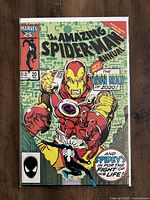 Colorful comic book cover showing Iron Man and Spider-Man with title and issue number visible.