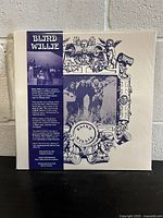 Front of vinyl album showing band name, psychedelic black-and-white-style artwork with sketched faces and figures, and a small photo of the band alongside descriptive text about the band's background and album details.