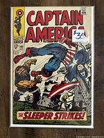 Front cover of Captain America #102 comic book showing dynamic action cover art with Captain America fighting villains.