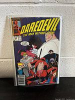 Front cover of Daredevil #259 comic book showing main characters including Daredevil and others with speech bubble 'Go get 'em, boys!'