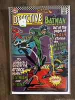 Front cover of Detective Comics #353 comic book showing Batman, Robin, Flash, and Weather Wizard with colorful vintage comic art