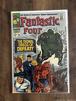 Front cover of comic book showing Fantastic Four characters and Doctor Doom with caption The Dismal Dregs of Defeat