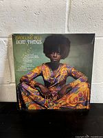 Front cover of the vinyl record showing the artist Madeline Bell sitting and the album title 'Doin' Things'.