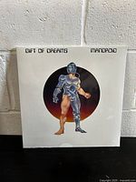 Front cover of the sealed vinyl record 'Gift Of Dreams' by Mandroid showing the cyborg artwork.