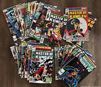 Photo showing spread of 37 "Master of Kung Fu" comics featuring various covers from the Bronze Age Marvel series.