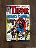 Front cover image of The Mighty Thor issue #390 comic book, featuring Avengers Assemble and guest Captain America on the cover.