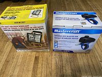 Boxes of 500 watt halogen work light and Mastercraft abrasive spot blaster gun, showing packaging and branding.