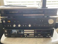 Stacked Technics tuner, amplifier, cassette deck overview