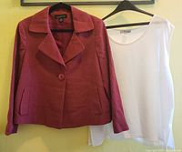 Full view of Classic Jones New York red jacket on left and Y&S Design white sleeveless top on right, both hanging on hangers