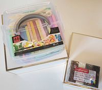 Plastic container with 46 pastel-colored modeling clay sticks and a U-shaped cutting tool