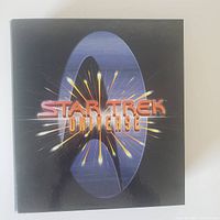 Front cover of 3 ring binder with Star Trek Universe logo