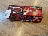 sealed Compac Gym box top view