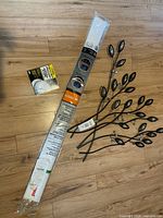 Cable cover, smoke alarm box, metal wall art on floor