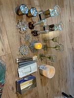 All candle holders and candles arranged on floor overview