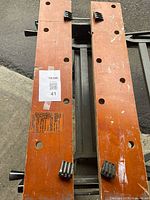 Top view showing two wooden jaws with dog holes, wear, bench dogs