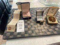 Group shot showing all jewelry items, boxes, and certificate