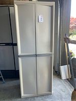 Front view of beige plastic resin cabinet