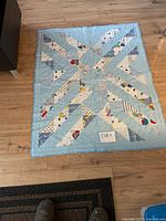 Light blue geometric starburst quilt full view