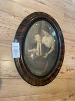 Front view showing entire oval frame and photograph