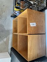 Four wooden storage cubes stacked 2 x 2