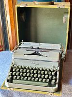Front view of Hermes 2000 typewriter in open carrying case