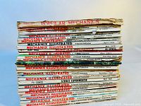 Stack of 20 vintage magazines showing the spines with Visible titles Popular Mechanics and Mechanix Illustrated and publication years from 1969 to 1973.