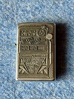 Front view of Zippo lighter with slot machine design and 'Million Dollar Machine' text