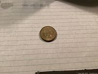 Obverse side showing Queen Elizabeth II portrait on 1985 Australian one dollar coin.