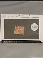 Photo showing the 5 cent Canadian beaver stamp mounted on a display card with catalog and price details.
