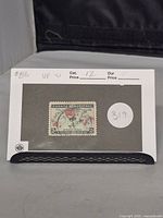Photo showing the full Canadian 1898 2 cent map Christmas stamp mounted on a white card with catalog number and price annotations.