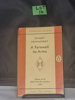 Front cover of Ernest Hemingway's A Farewell to Arms by Penguin Books showing title, author, and Nobel Prize mention.