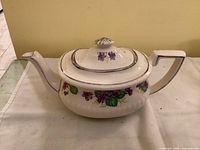 Front side of the Gibsons teapot showing floral decoration and Georgian shape.