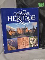 Front cover of the book titled 'Our World's Heritage' with images of heritage sites and nature.