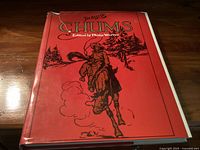 Front cover of The Best of Chums book showing red dust jacket with cowboy illustration and torn edges.