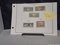 Five postally used U.S. Airmail stamps from 1926 to 1928 mounted on white album page with a label 'Lot #361'. The stamps include early plane depictions and the famous Spirit of St. Louis Lindbergh stamp.