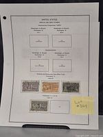 Collector's album page showing four used U.S. Special Delivery stamps from 1922 to 1931. Stamps indicate images of postal workers delivering mail by motorcycle and truck. Mounted on perforated album page with lot number sticky note.