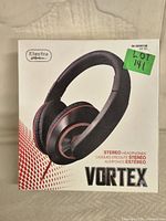 Box of Vortex stereo headphones in black, showing front of packaging with product image and branding.